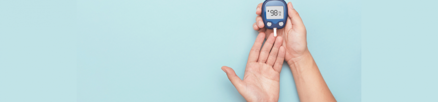 Man using glucometer checking blood sugar level 