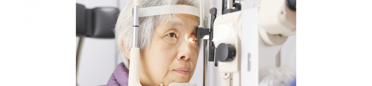 Older Asian woman having her eyes examined