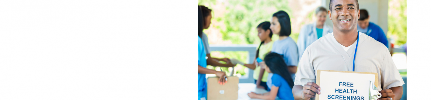 A healthcare professional holding a 'free health screenings' sign