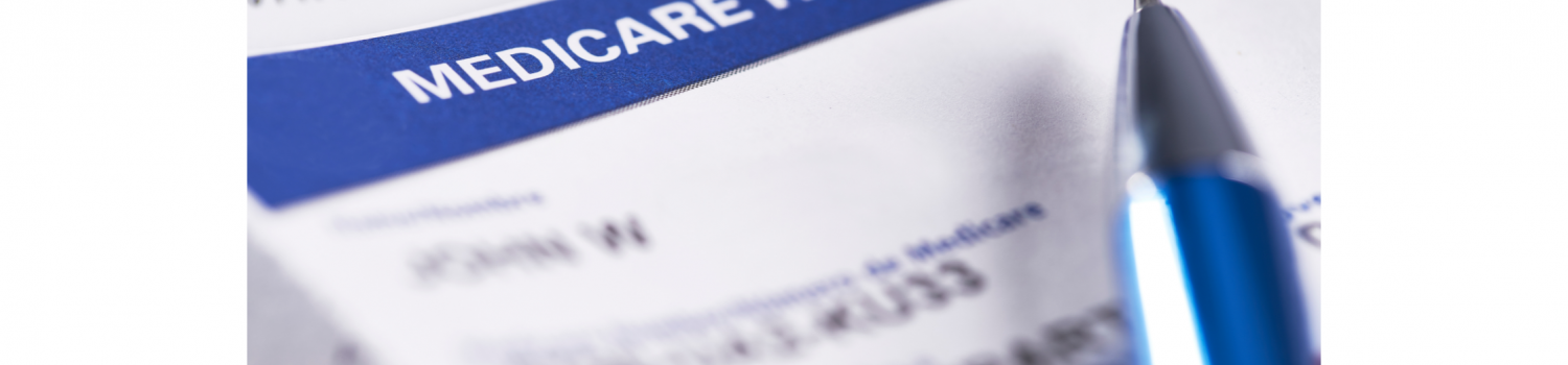 Close up of Medicare insurance card with pen