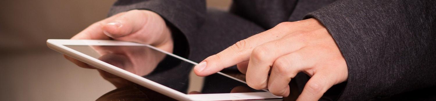 person holding tablet