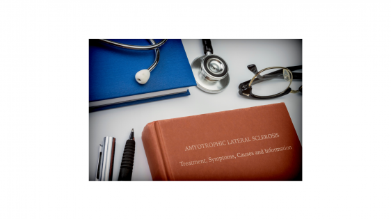 Conceptual image of a book entitled “Amyotrophic Lateral Sclerosis” alongside a stethoscope, eyeglasses, notebook, and writing utensils
