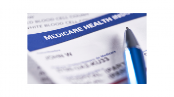Close up of Medicare insurance card with pen
