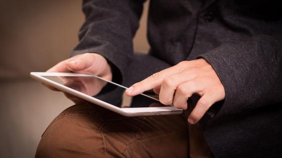 person holding tablet